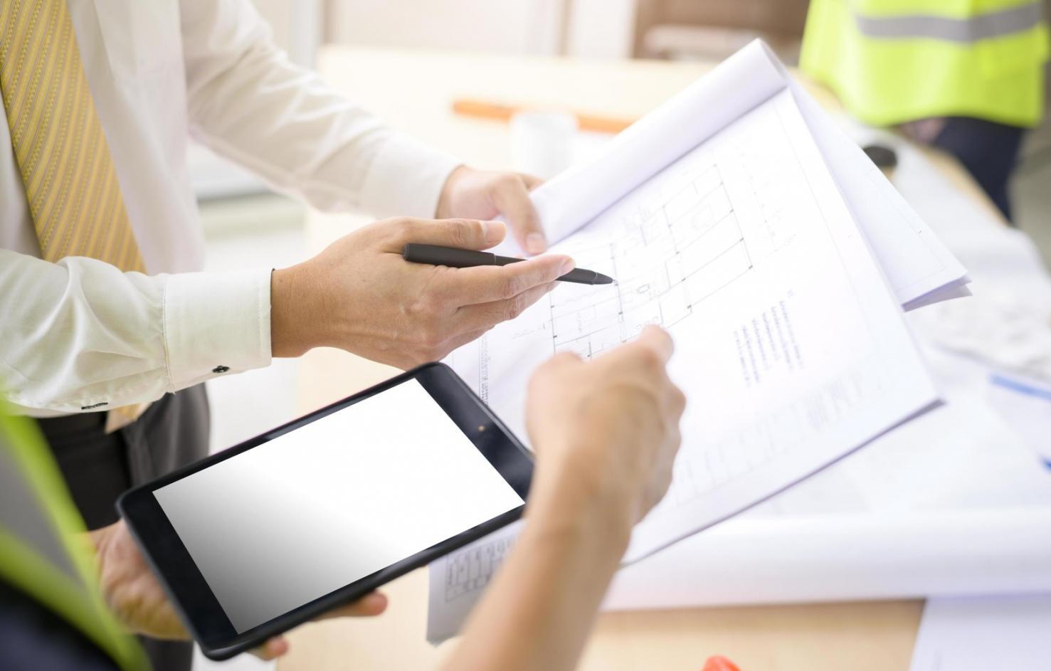 Investment analysis workspace showing portfolio review documents and market data charts